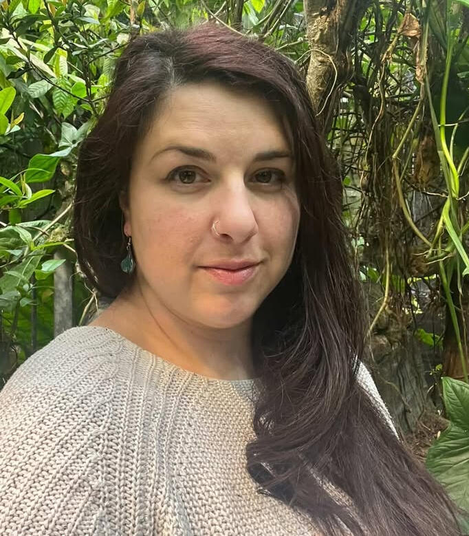 Portrait of Ilena Aneli among green plants